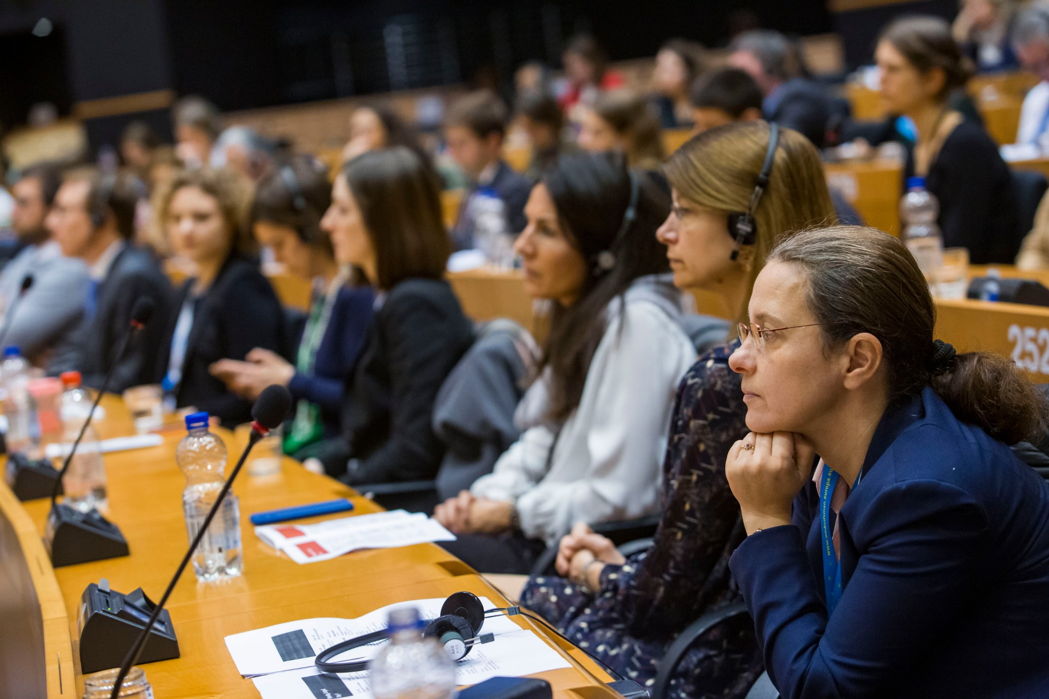 Social group, Microphone, Human, Table, Chair, Desk, Tableware, Community